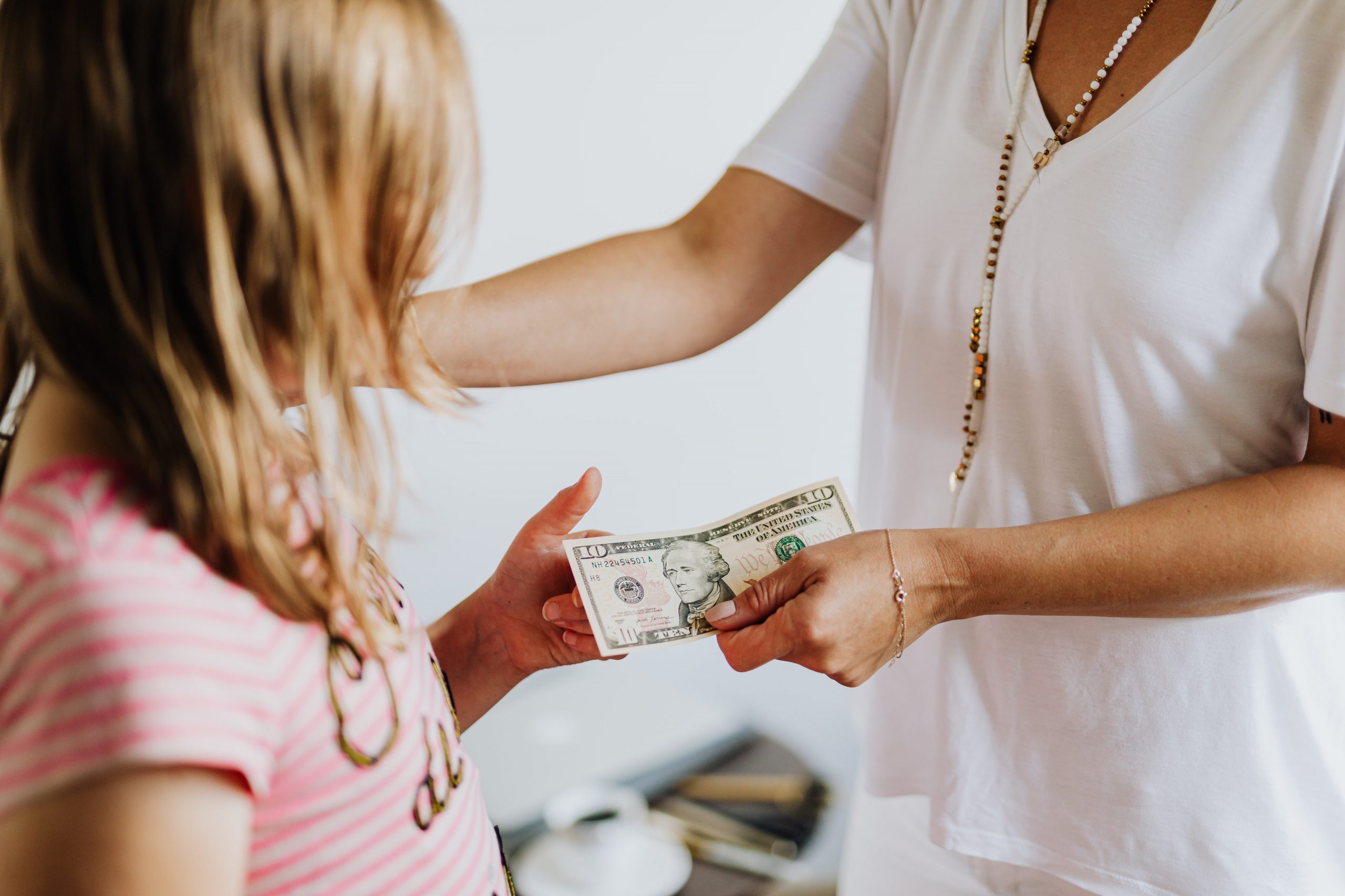Mom giving daughter money